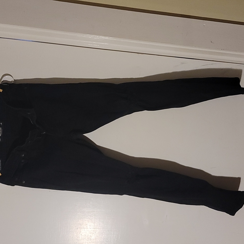 Hollister black in color with holes in the knees 30 x 32